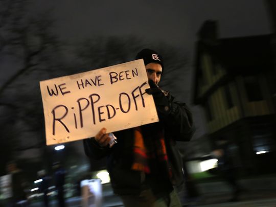 A group of protesters were outside at Wayne State University before an event about Detroit's bankruptcy on Wednesday, Dec. 9, 2015. (Photo: Jessica J. Trevino Detroit Free Press)