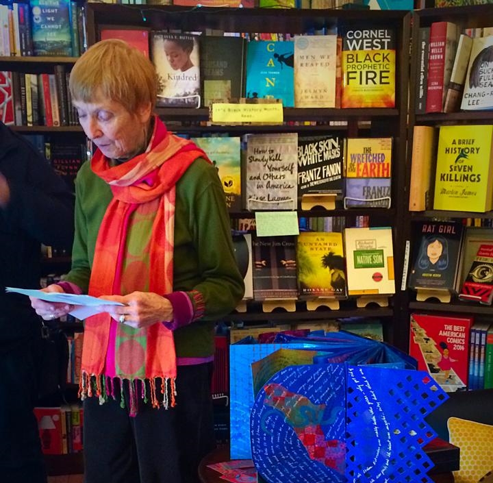 Susan Porter reads her work on Valentine's Day 2014 as she unveils her art pieces on display in Papercuts J.P.