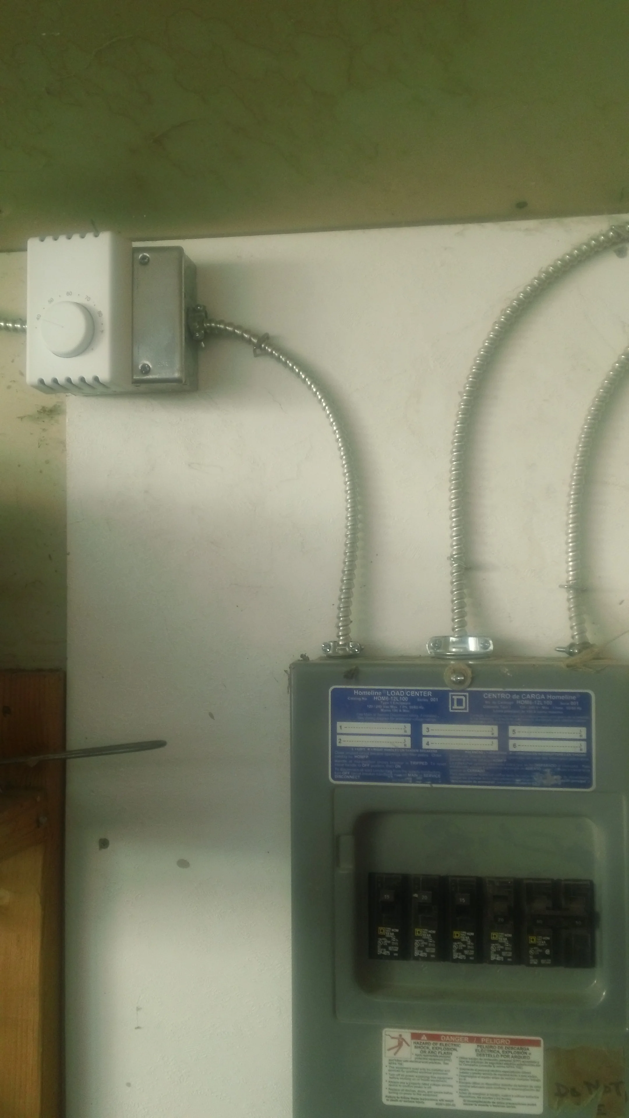 The thermostat on the left works with the outlets inside the greenhouse. When temperatures dip below freezing inside, the small, temporary space heater kicks on to protect seedlings on cold mornings. 