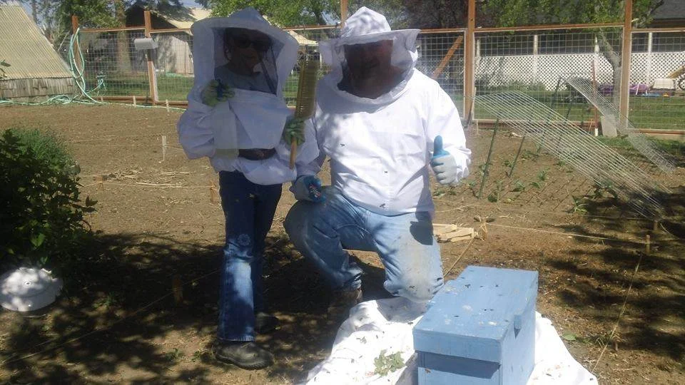 Eleanor and Eric celebrating our swarm catch last spring.