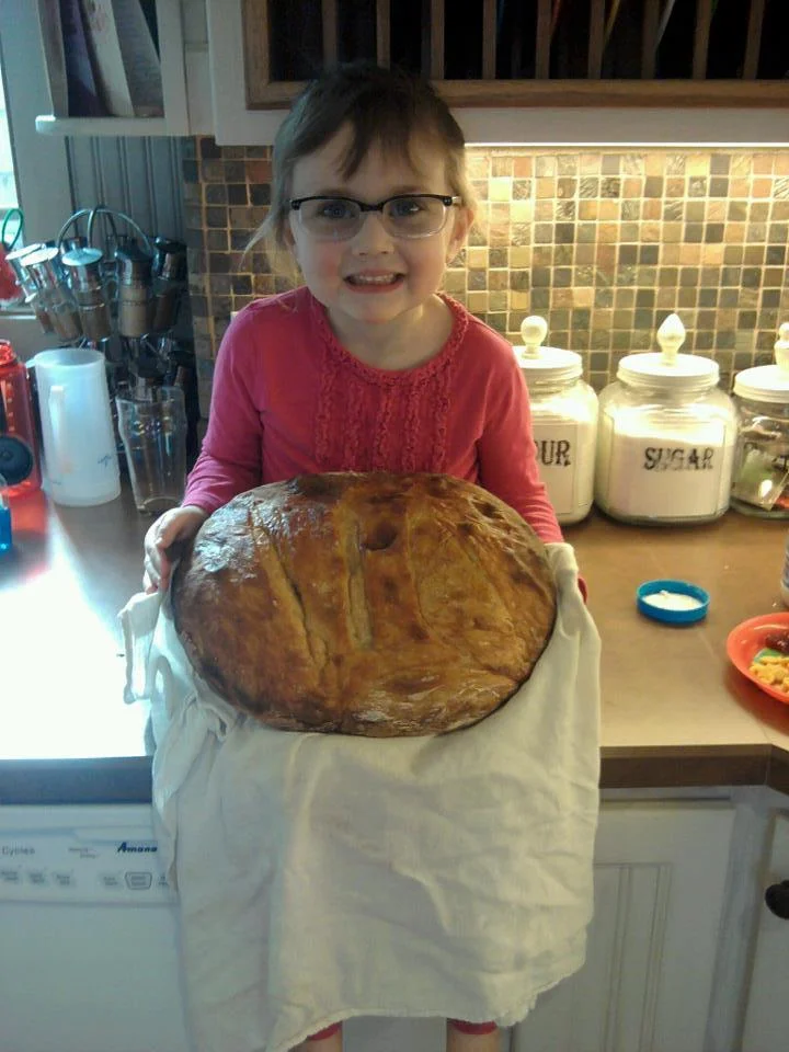 Eleanor and our first bread loaf using the artisan bread making technique. Now that's a big loaf of bread!