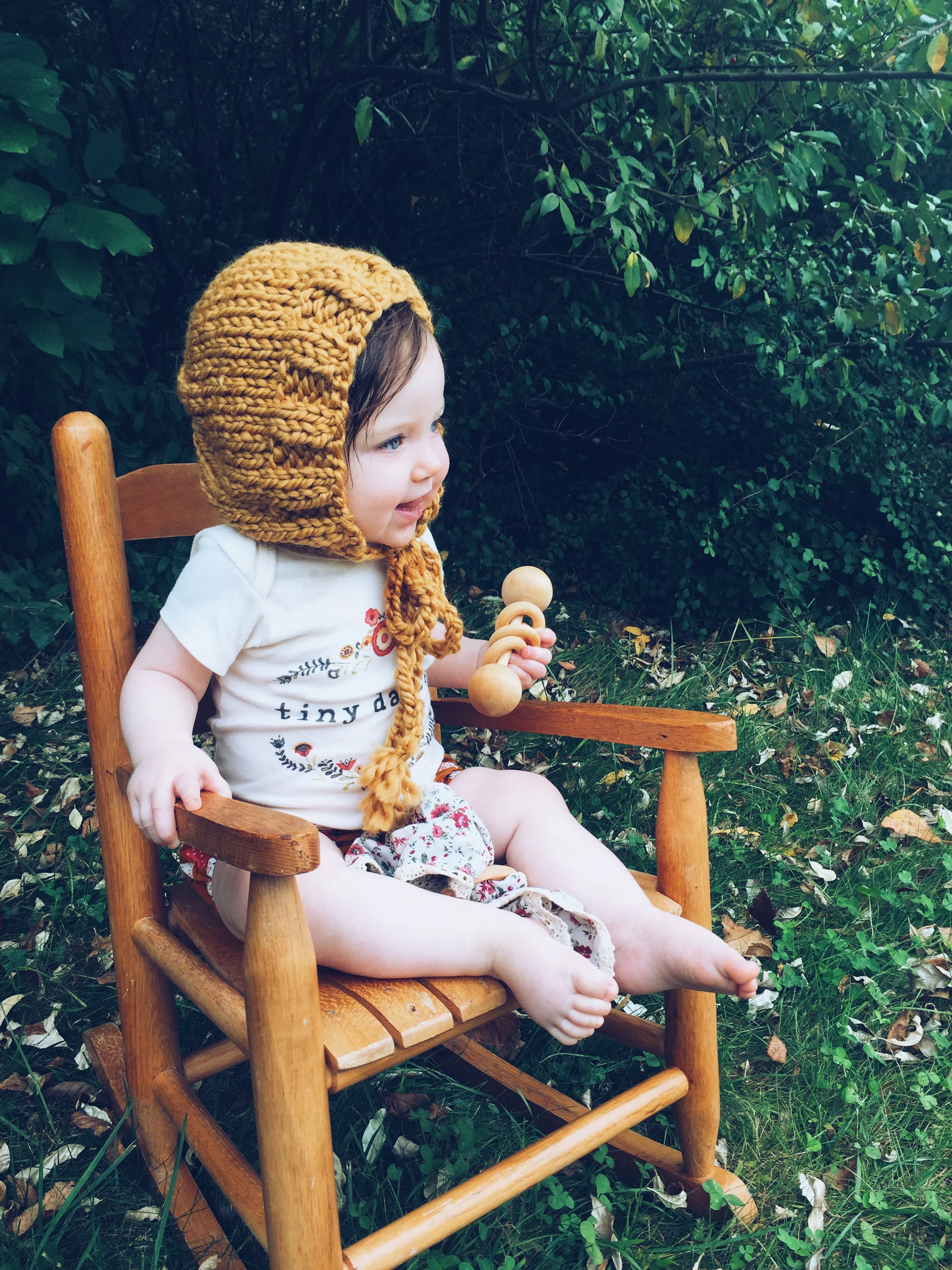 yellow knitted baby outfit