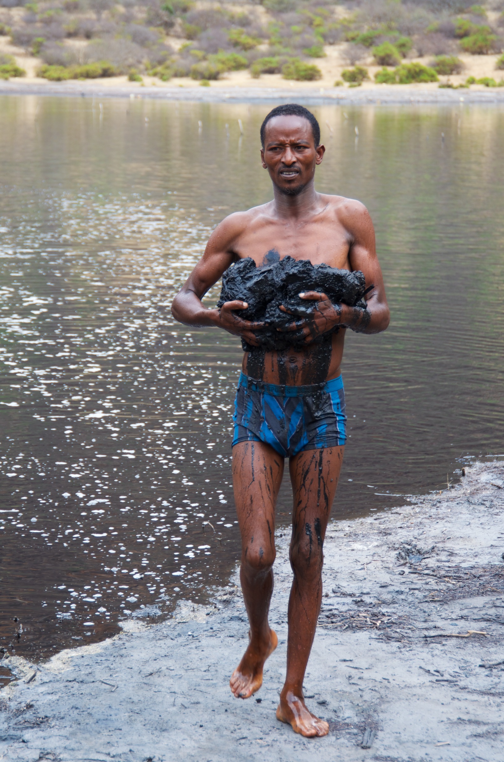  Man collecting salt, Saline crater lake, Chew Bet 