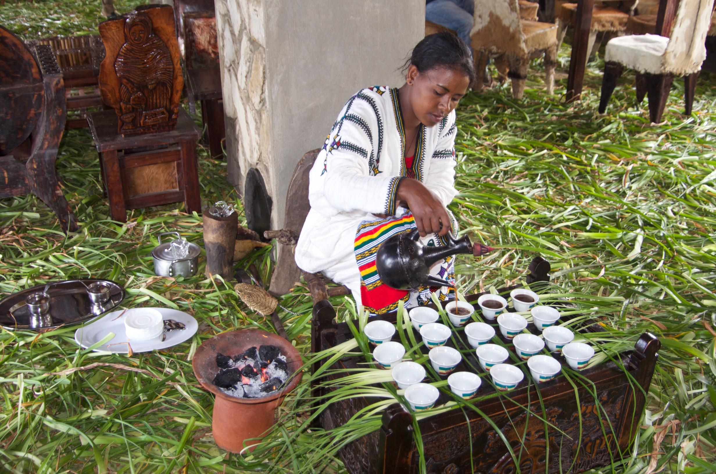  Pouring coffee at ceremony, Kosoye Befiker restaurant, near Gondar 