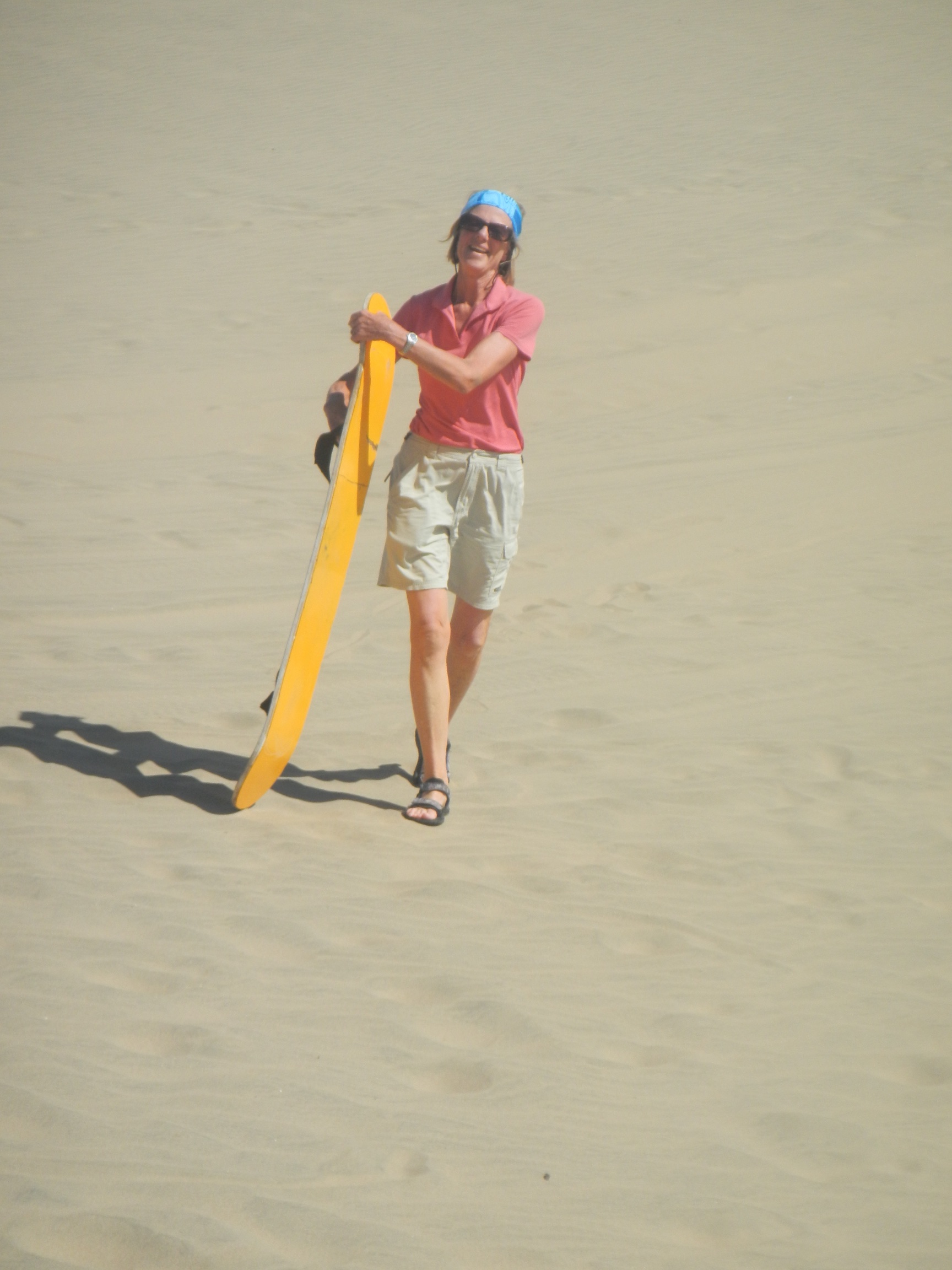  Corinne with sand board, sand dune, Ica, Peru 