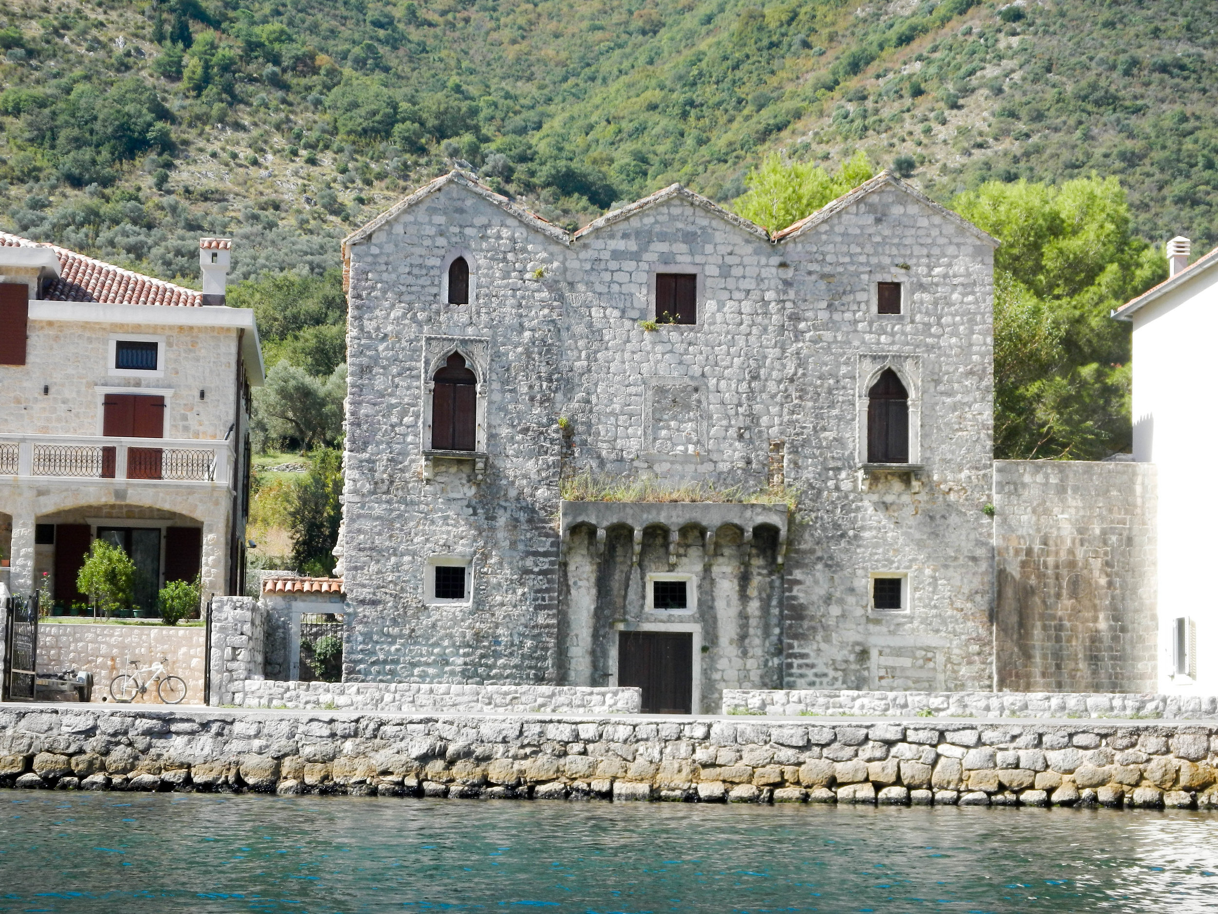 Old house (3 sisters sad story) from kayak, Kotor, Montenegro