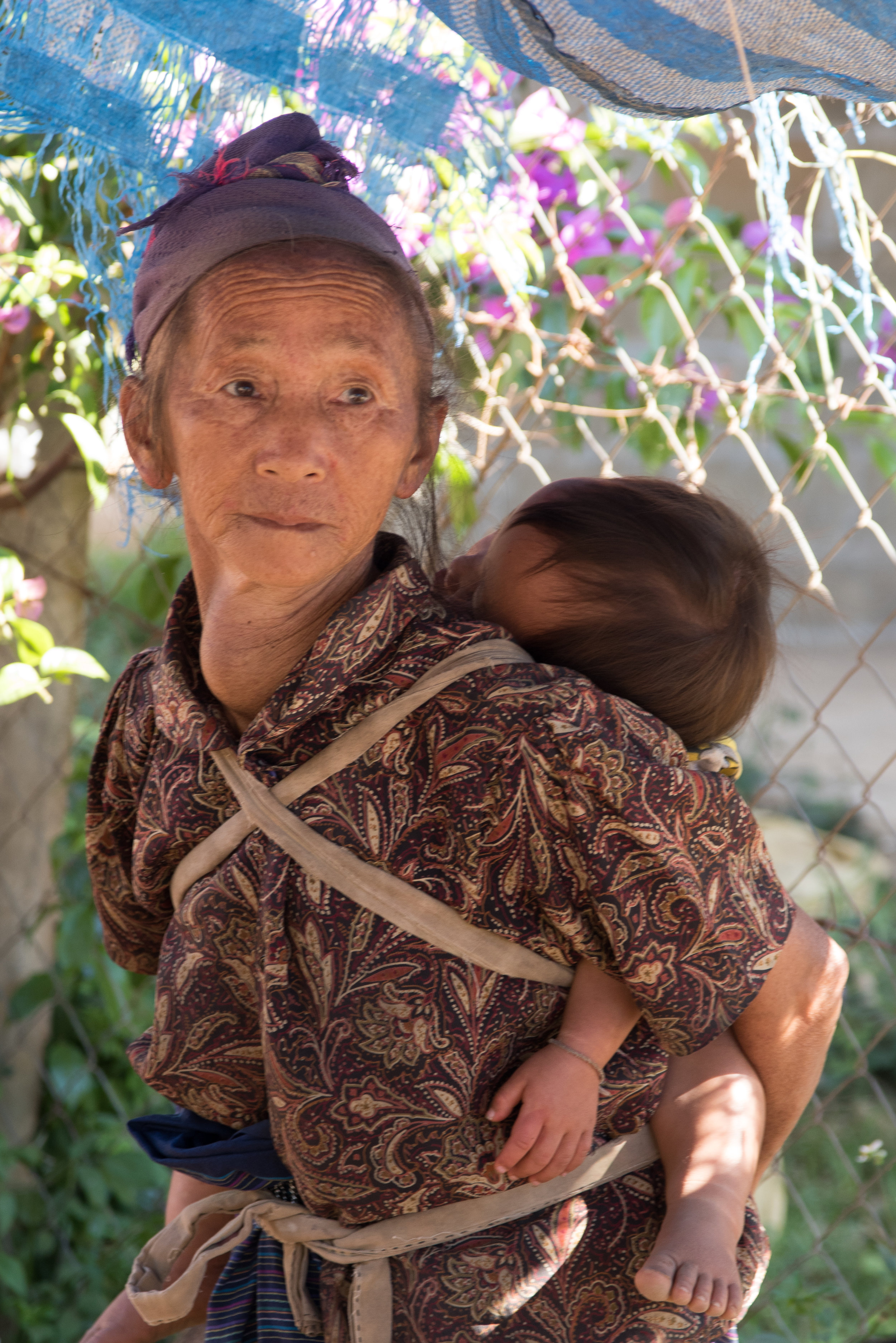 Grandmother and child in village, Ban Phajao, Laos