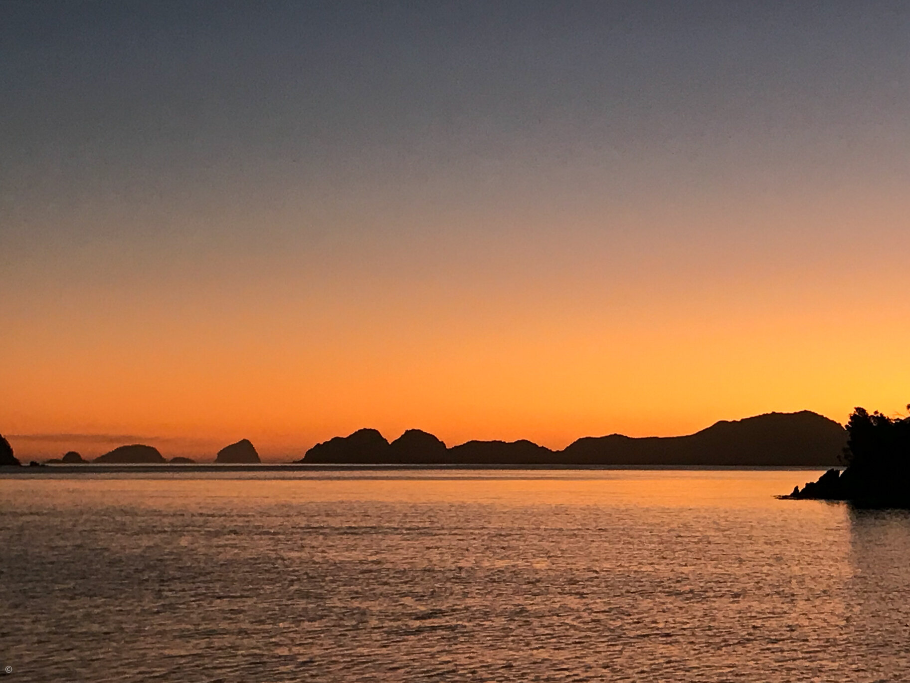 Breaksea Islands at sunset from Bramble Cove