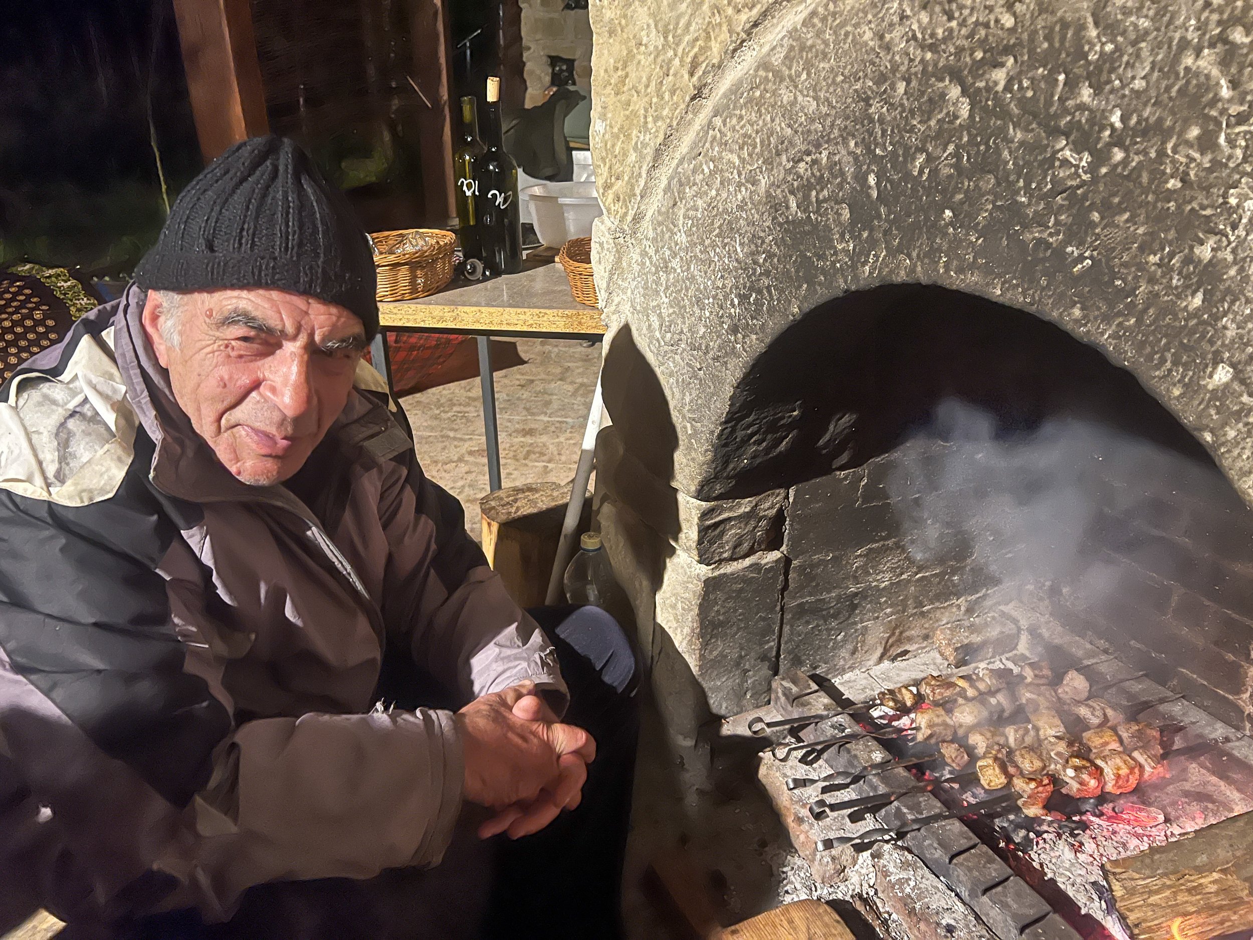 Cooking barbecue at Nika Vacheishvili's Wine Cellar in the Ateni Valley, Georgia