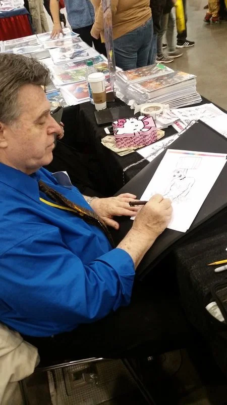 Neal making his way through the stack of Harley Quinn/Deadpool sketch requests. WHY DO YOU ASK NEAL ADAMS TO DO HARLEY QUINN OR DEADPOOL