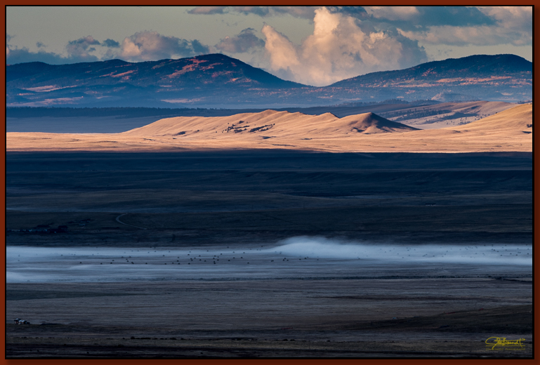 "South Park Expanse" ©2016 Jon S. Berndt The view of South Park, south from Kenosha Pass. From fog to sunlight to distant mountain range, I enjoyed this view for it's massive depth.