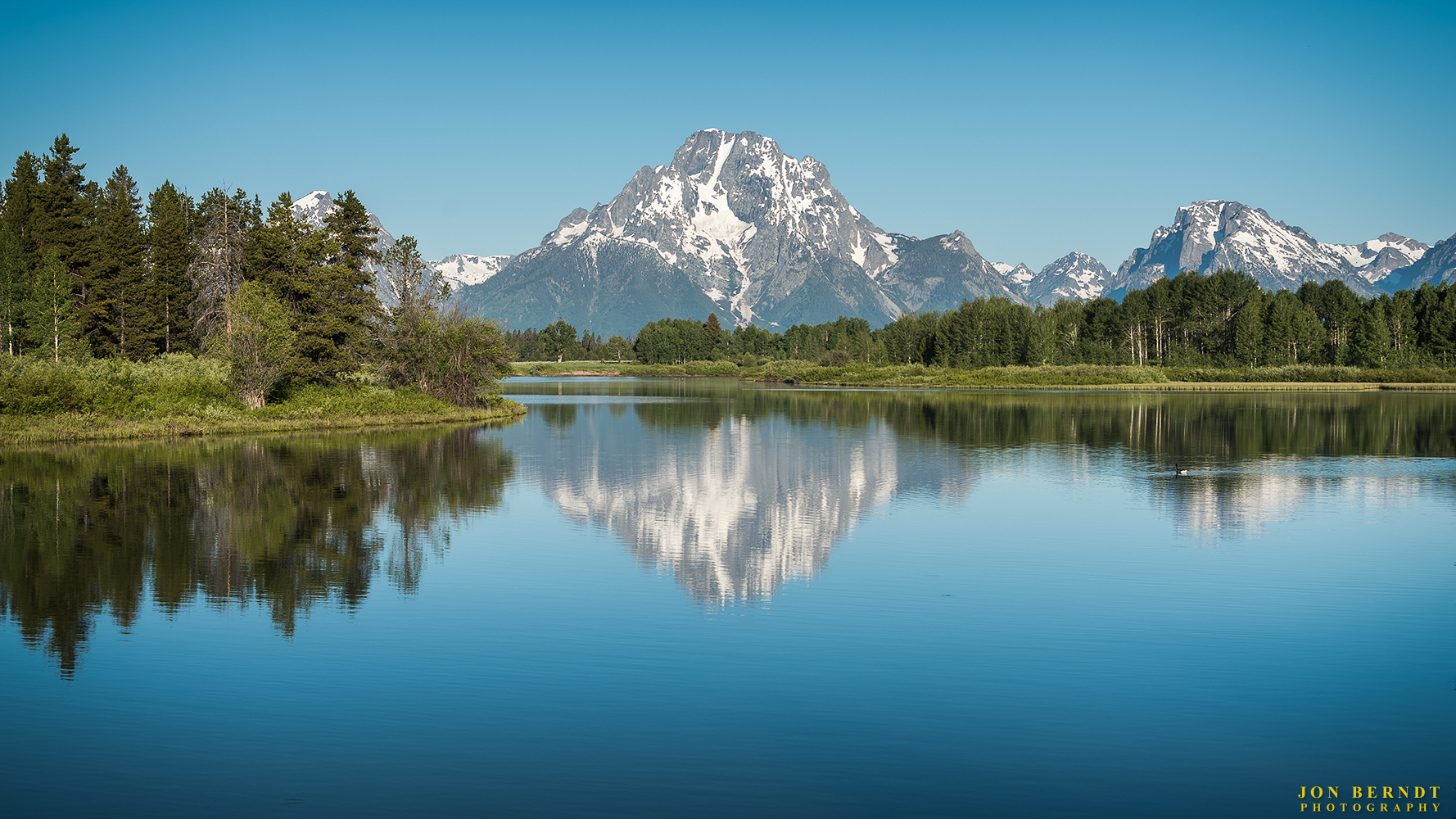 The view of Mount Moran reflecting in the Snake River at Oxbow Bend. Click here for information on ordering a print of this photograph.