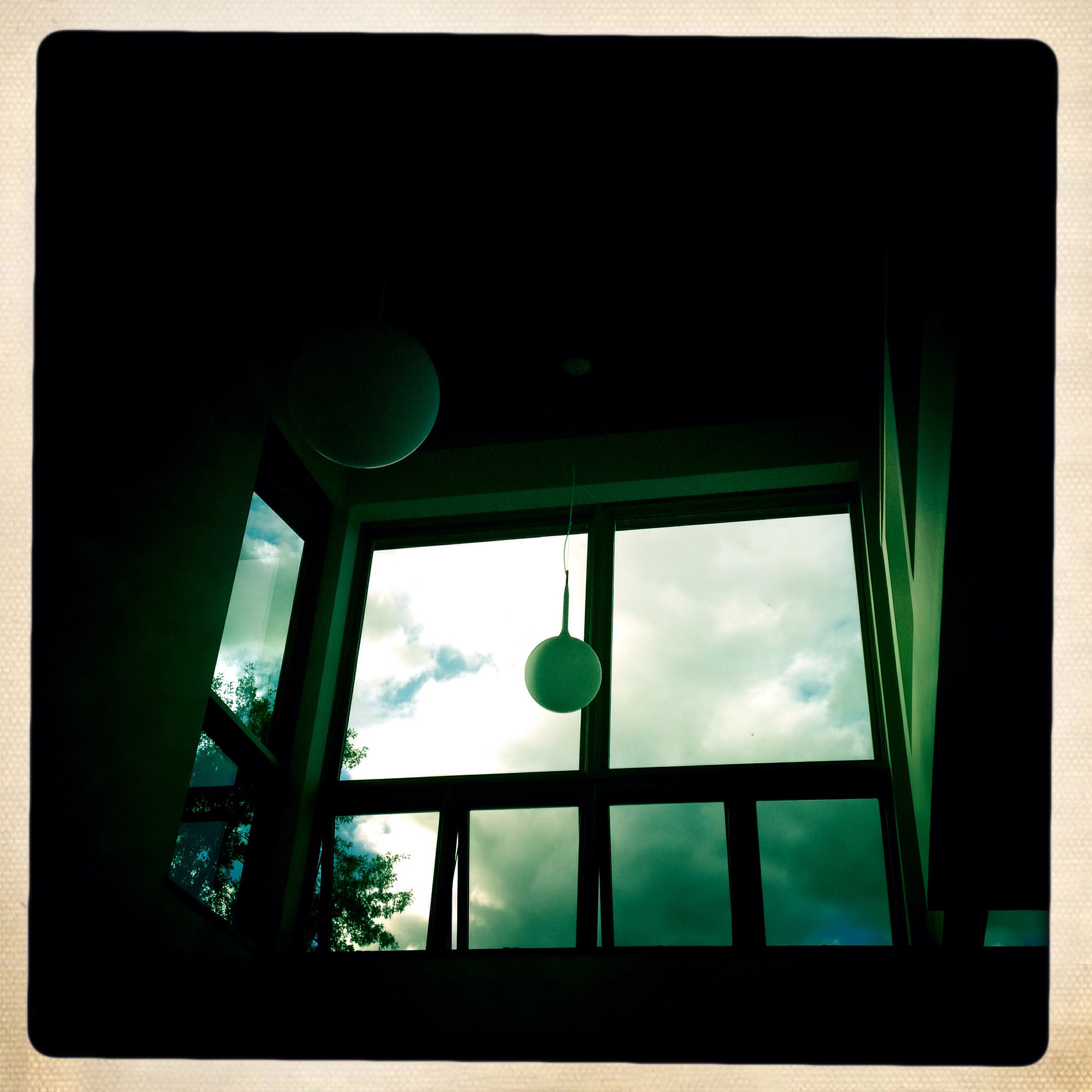 Artemide ‘Castore’ fixtures float above the living room.