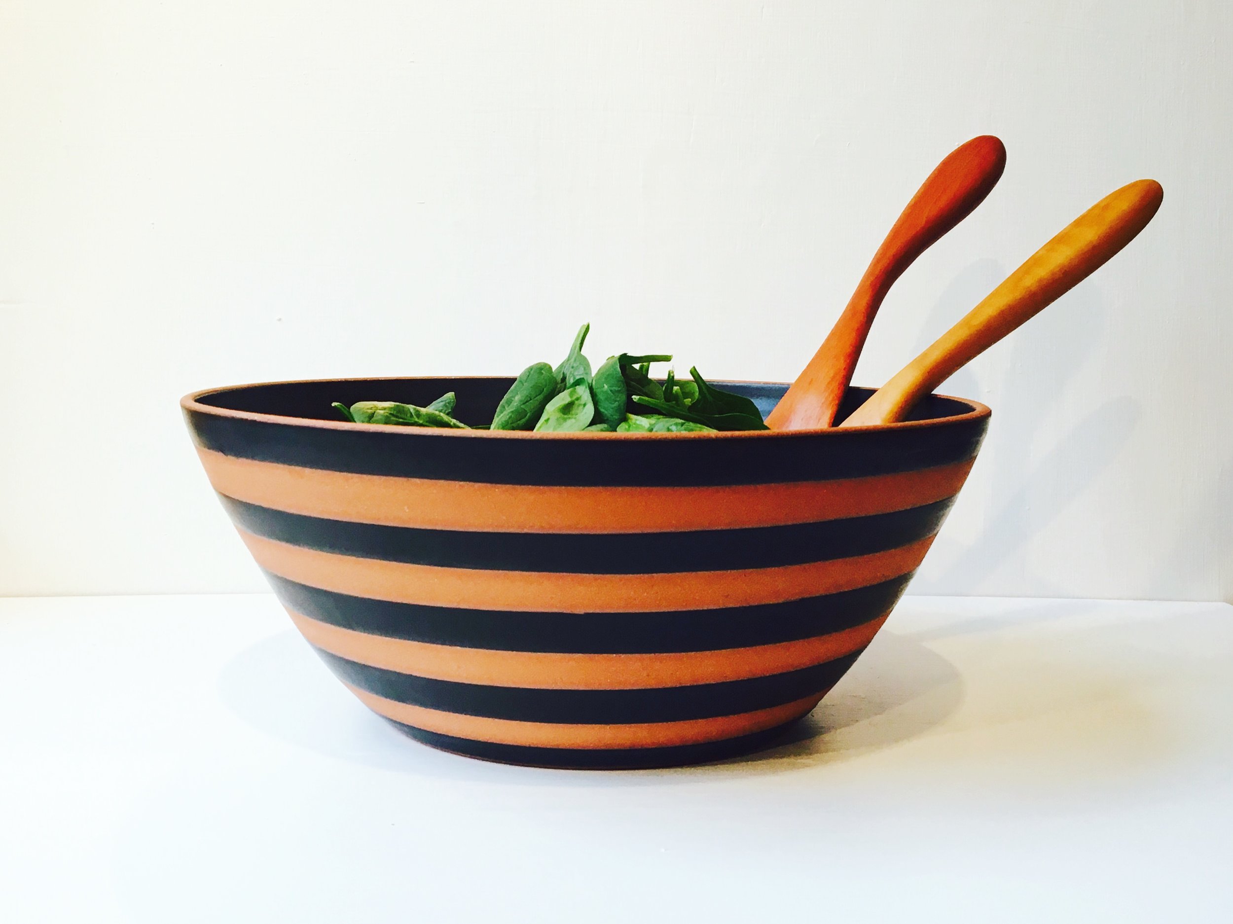 Studio Wares All Wolf Ceramics studio wares are made with red and golden stoneware clays. They are hand thrown and intended for every day use. Though they are dishwasher and microwave safe, hand washing and handling with care will extend the life of your ceramics. Hand washing is recommended particularly for pieces with colored underglaze designs on the edges. Please feel free to contact Sarah with any questions.
