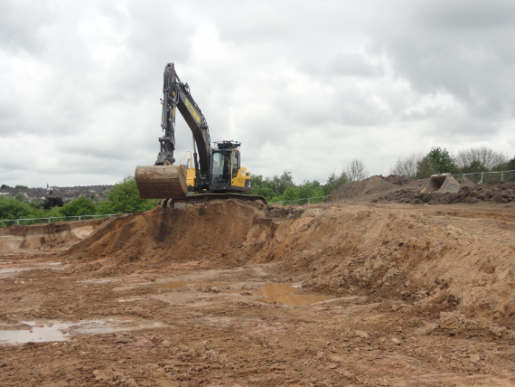 The depth of the 'cut' here allows for this higher quality subsoil material to be layered on top of the mining spoil to create the foundations for a quality sports surface.