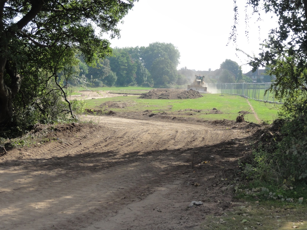 The shape of the watercourse is marked as the topsoil is stripped