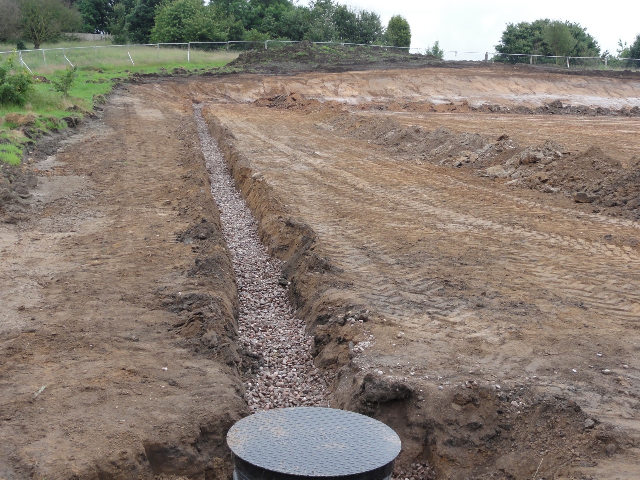To combat the difficult ground conditions, a deep drainage system had to be installed before work could properly begin on the pitches. Following its installation, the deep drainage system successfully de-watered the site. 