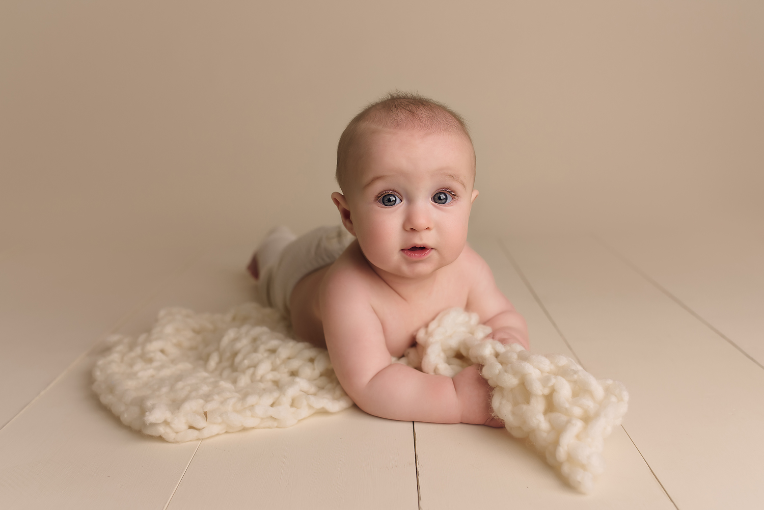 Baltimore Maryland Newborn Baby photography baby boy on tummy cream background Jessica Fenfert
