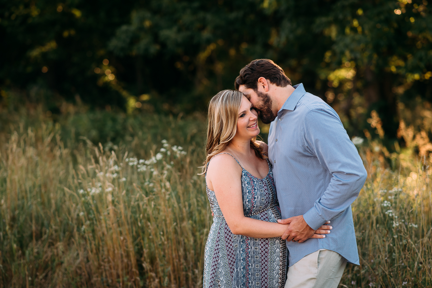 maternity photography pregnant woman in dress with husband tall grasses Baltimore Photographer