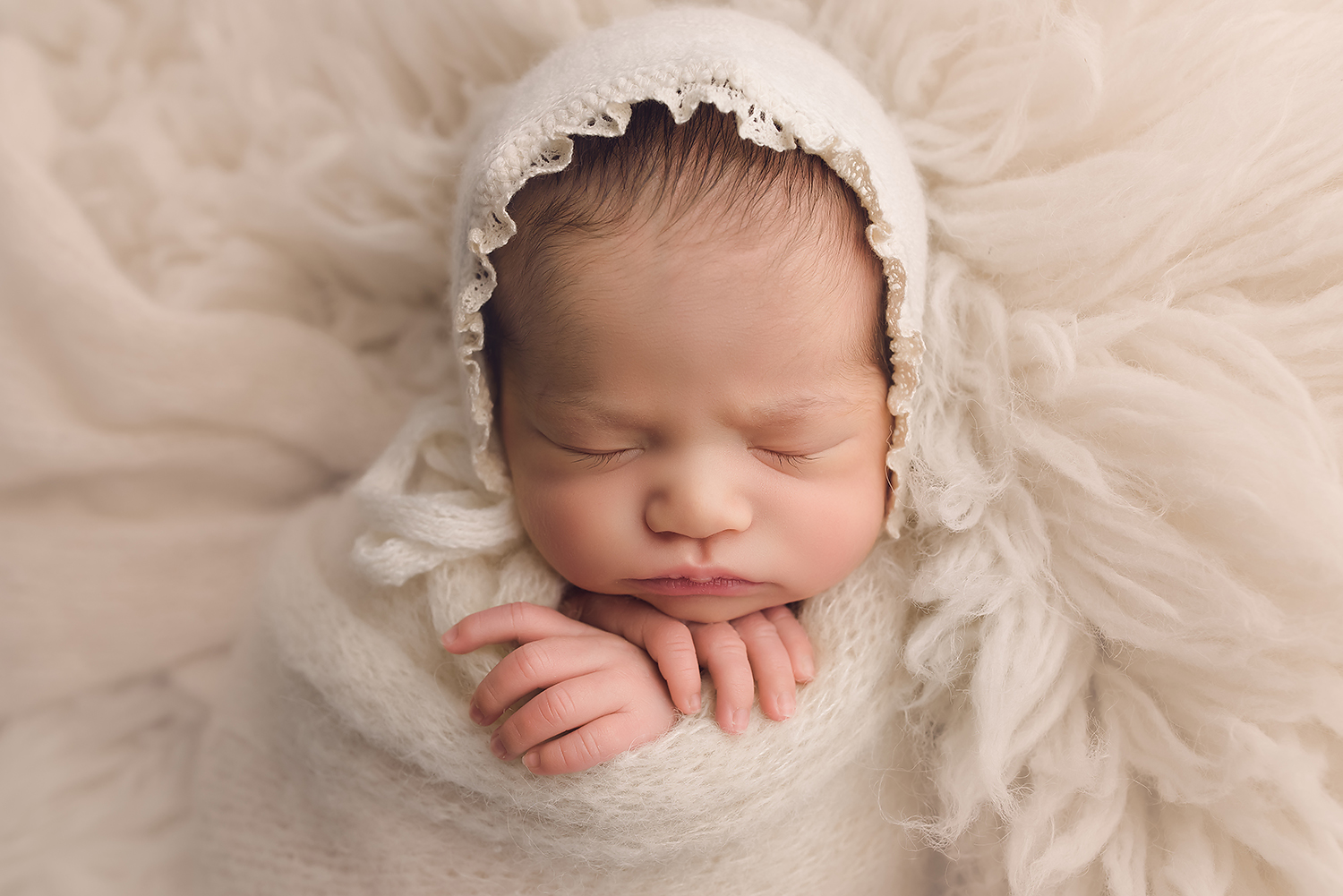 Baltimore Maryland Newborn Photographer Jessica Fenfert baby girl on cream flokati bonnet
