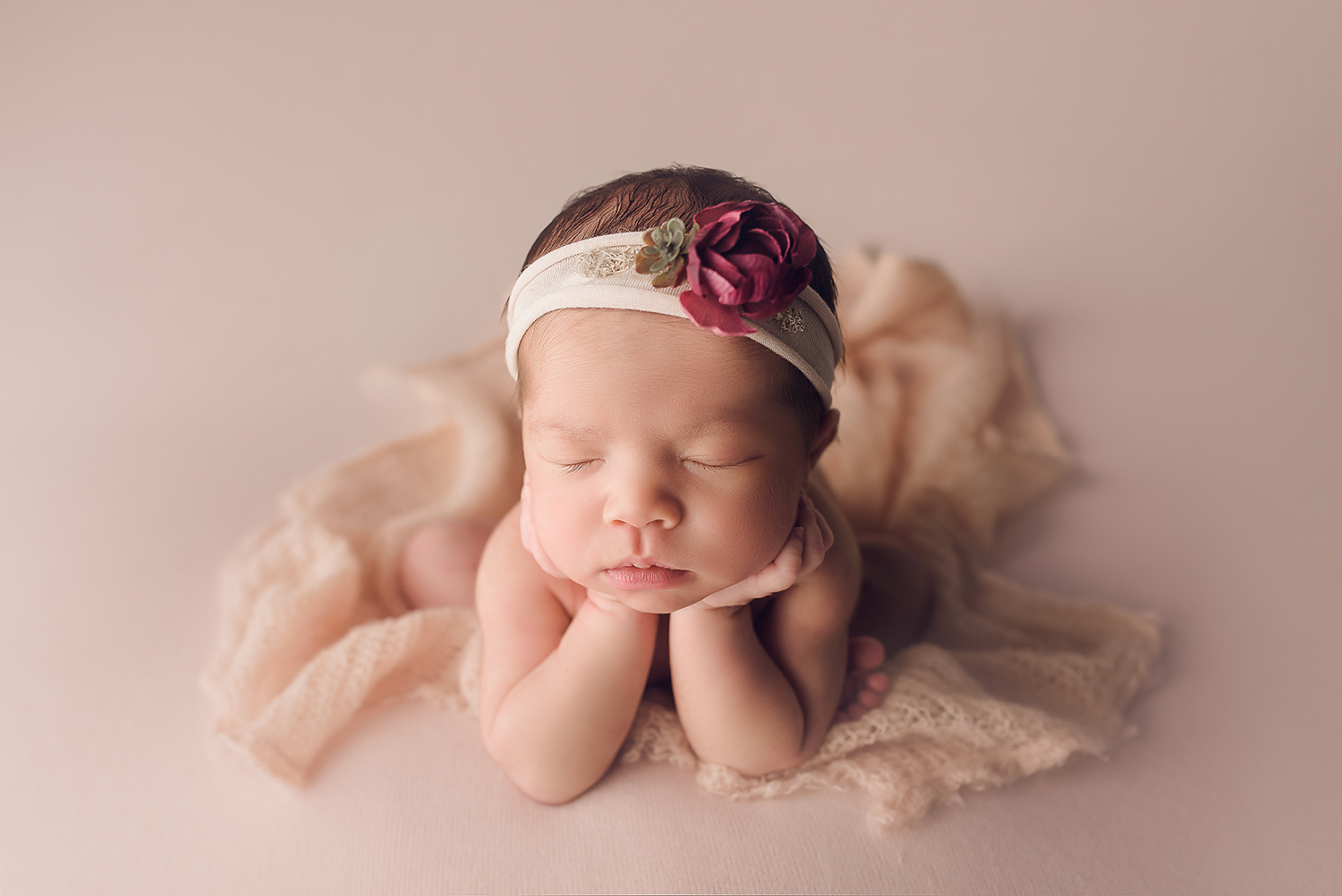 Baltimore Maryland Newborn Photographer Jessica Fenfert baby girl on pink froggy pose