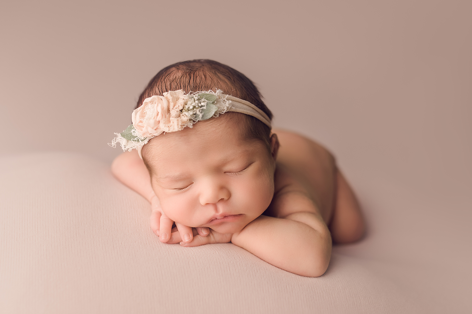 Baltimore Maryland Newborn Photographer Jessica Fenfert baby girl on pink head on hands