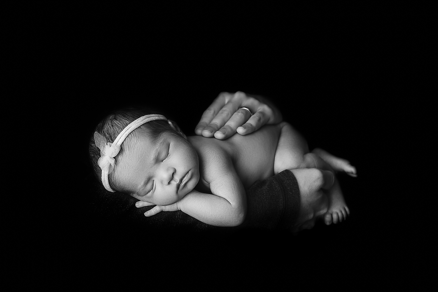 Baltimore Maryland Newborn Photographer Jessica Fenfert baby girl dads hands black and white