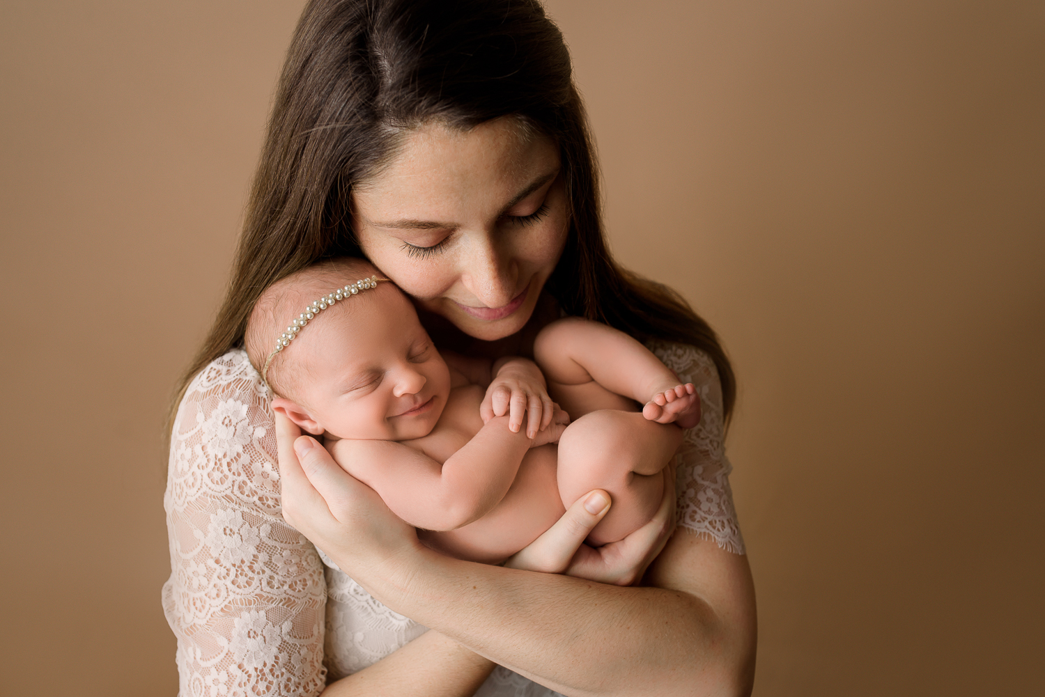 Baltimore Maryland Newborn Photographer Jessica Fenfert baby girl smiling in moms arms