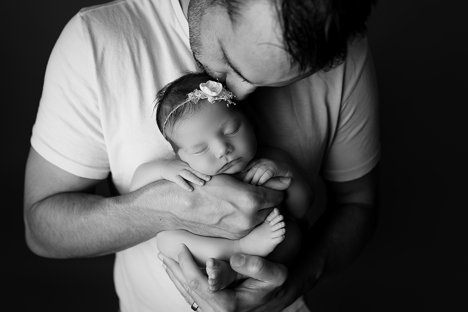 Baltimore Maryland Newborn Photographer Jessica Fenfert baby girl in dads hands