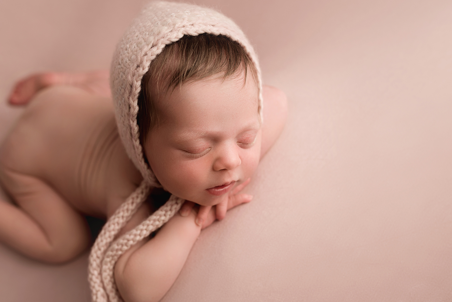 Baltimore Maryland Newborn Photographer Jessica Fenfert girl on pink head in hands