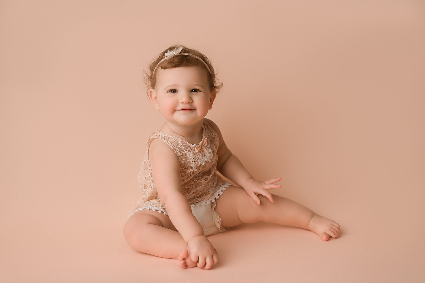 Baltimore Maryland Newborn Baby photography baby girl peach background Jessica Fenfert