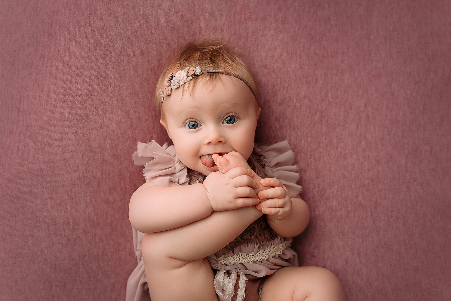 Baltimore Maryland Newborn Baby photography baby girl cake on pink background Jessica Fenfert