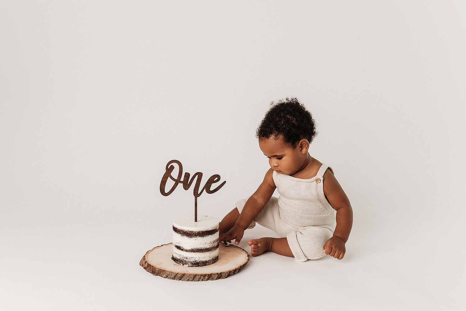 Baltimore Maryland Newborn Baby photography baby boy cake smash on white background Jessica Fenfert