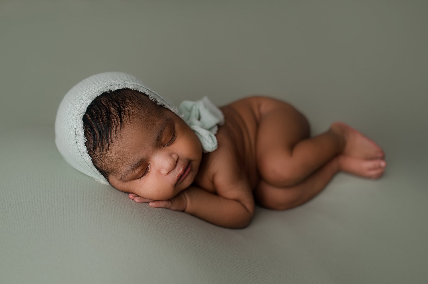 Jessica Fenfert Baltimore Maryland Newborn Photographer baby girl side lying sage