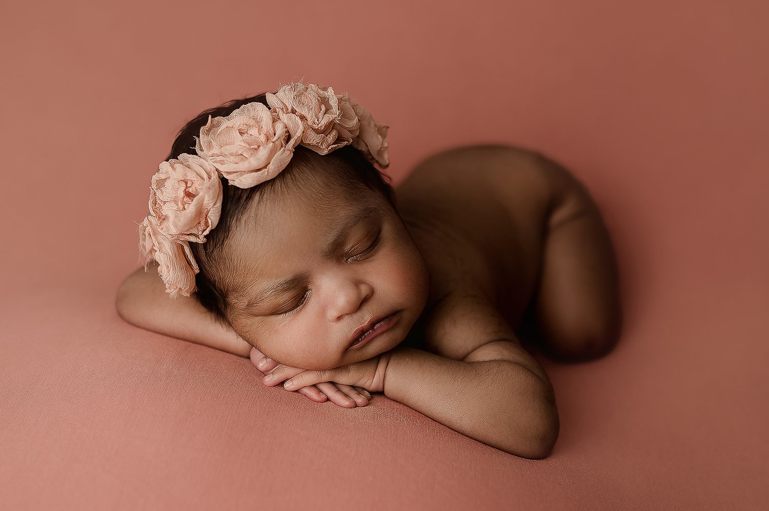 Jessica Fenfert Baltimore Maryland Newborn Photographer head on hands pose in pink