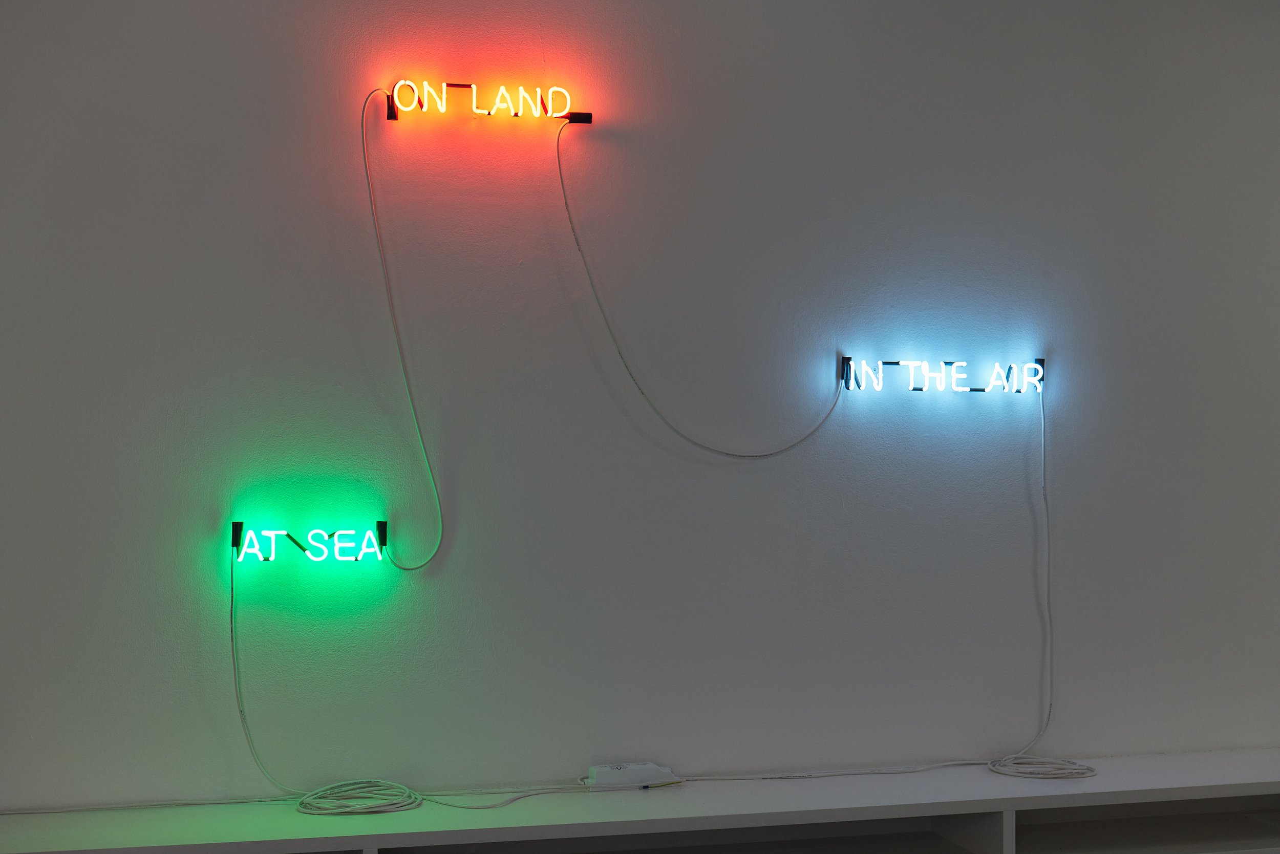   On Land, at Sea, in the Air (Defend Poetry) , 2021  Neón / Neon  6.5 x 38.5 cm; 6.5 x 48 cm; 6.5 x 30 cm 