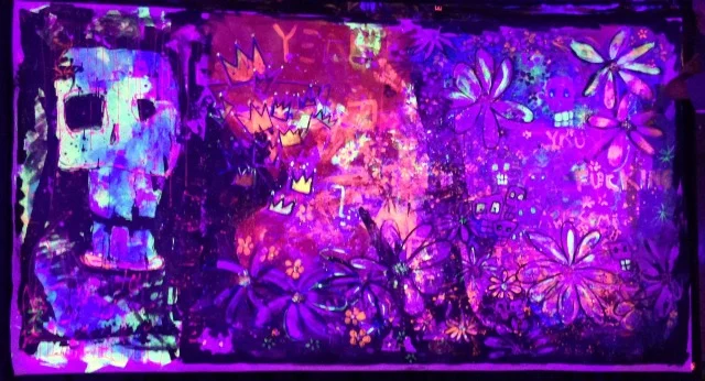 This is a 5' x 9' black light painting that was used as a backdrop for the stage.