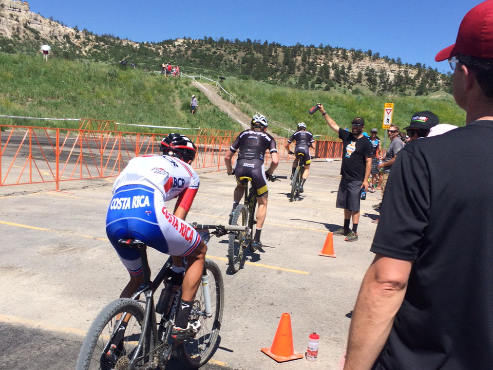 Here is what the feed zone at a PRO XCT is like. Riders come by very quickly and need perfect water bottle hand offs every lap.