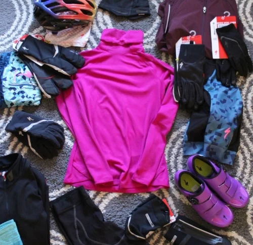 A base layer (the fuchsia long sleeve) should wick away sweat and dry quickly so you don't have cold wet fabric against your skin.