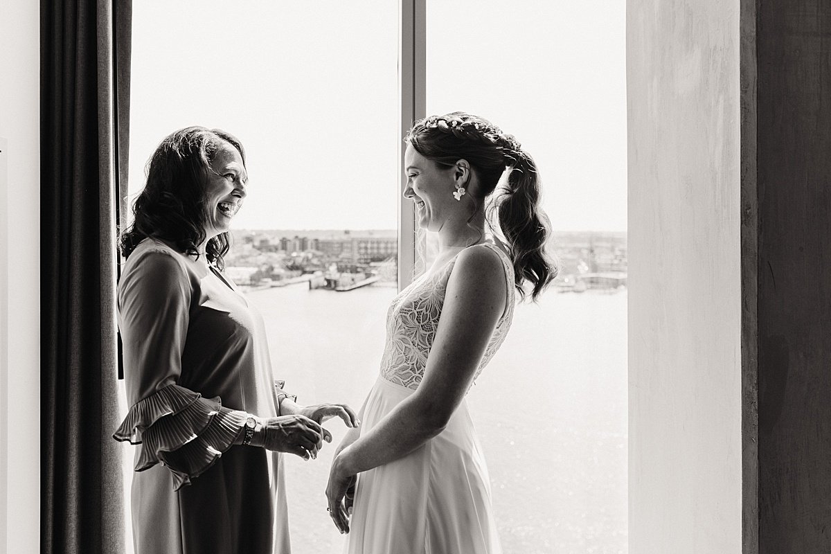 urban-row-photo-bride-getting-ready-with-mom-canopy-harbor-point-baltimore_0004.jpg