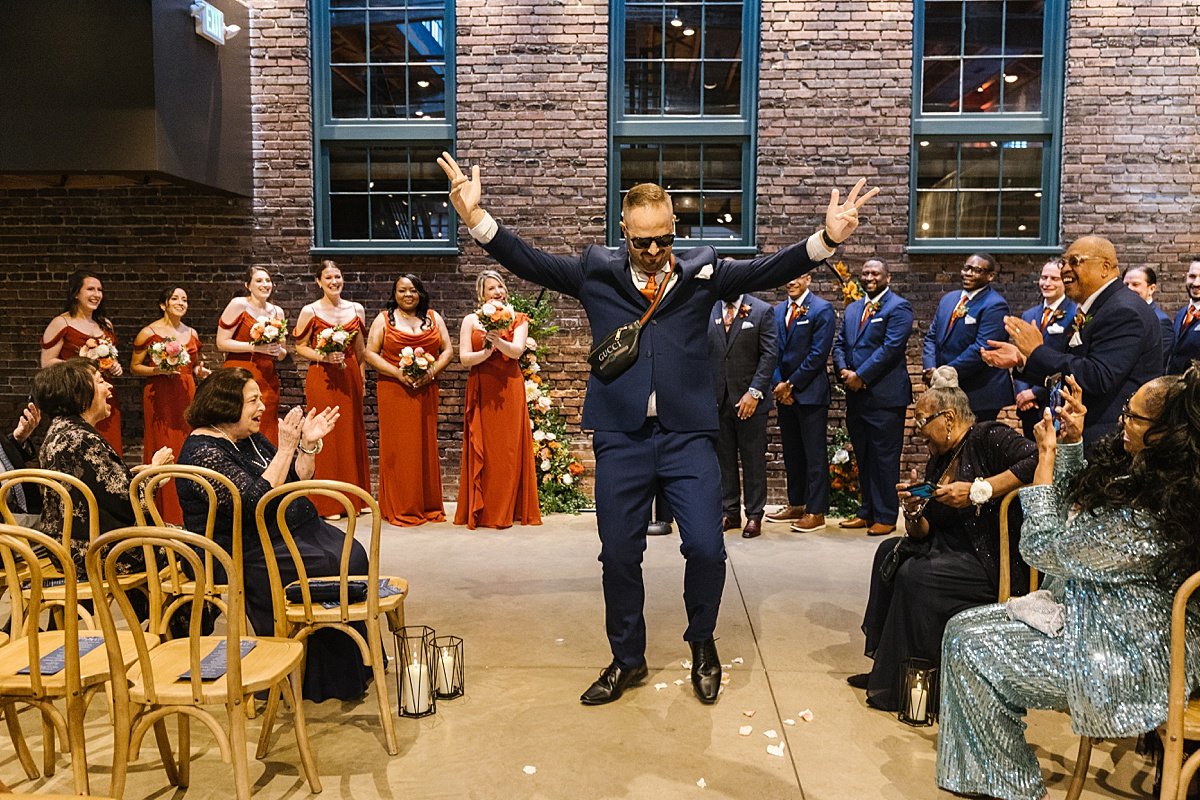 alicia + jarett navy blue and terracotta fall wedding at the winslow