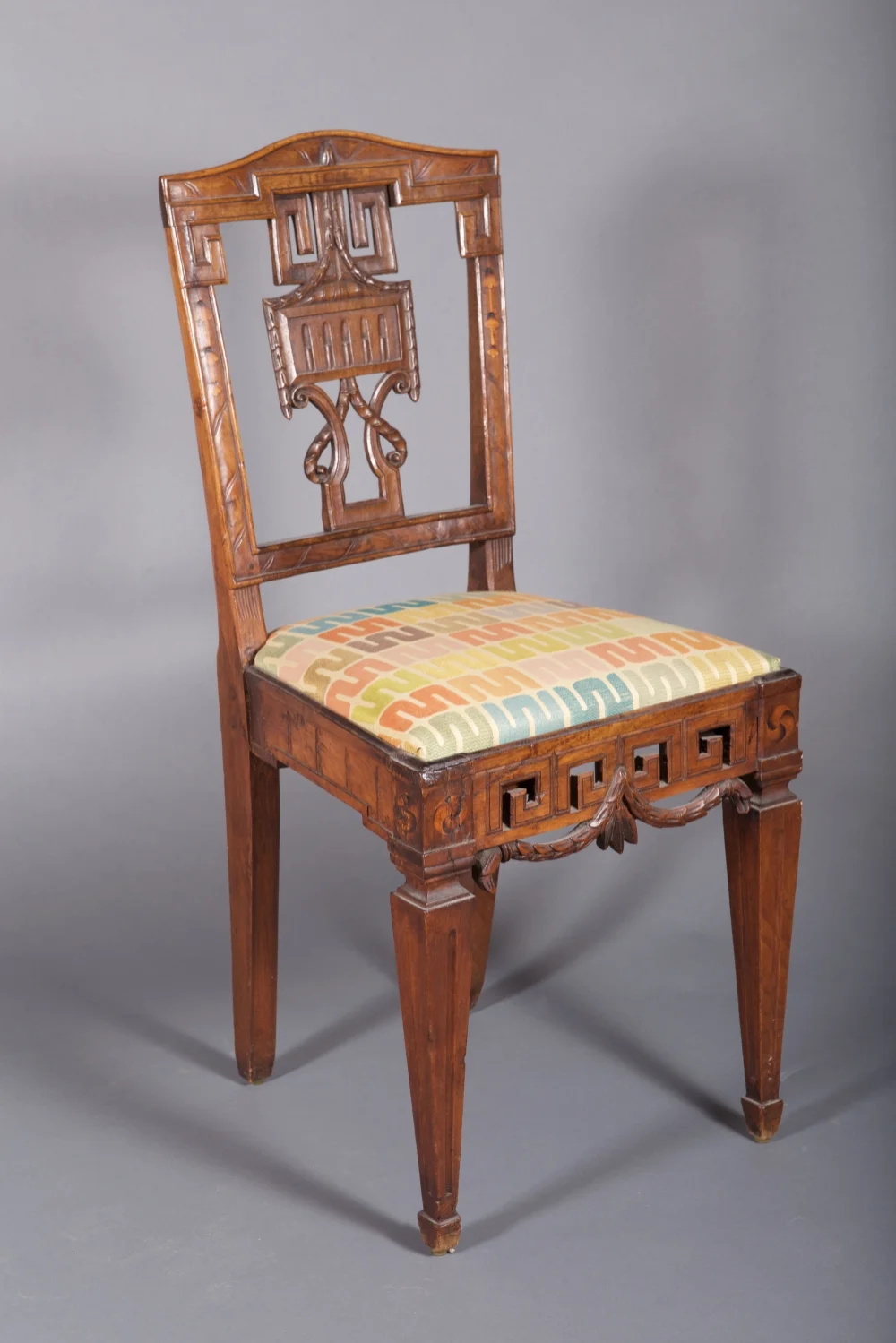   A Pair of Louis XVI Side Chairs. Poland, ca 1780   A pair of Louis XVI carved and inlaid walnut side chairs in the Grecian taste. Polish (Kolbuszowa), ca 1780.  Cf: An almost identical chair formerly in the Tadeusz Wierzejski Collection ill. Bozenn
