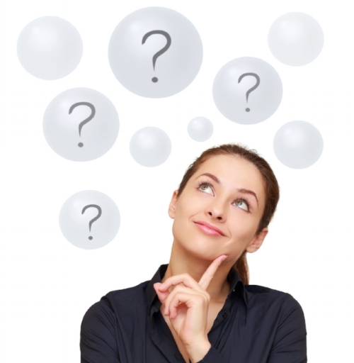 Happy business woman looking on questions in bubbles isolated on