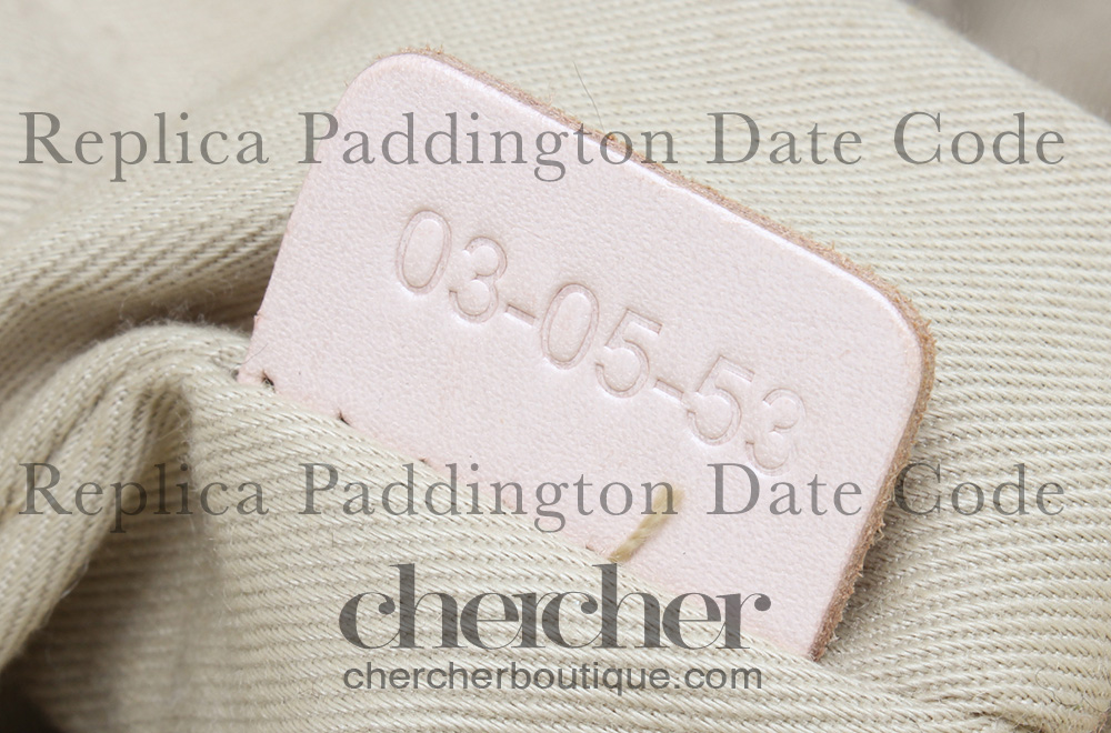 A replica Paddington bag's date code heat stamped on real calf leather tab.