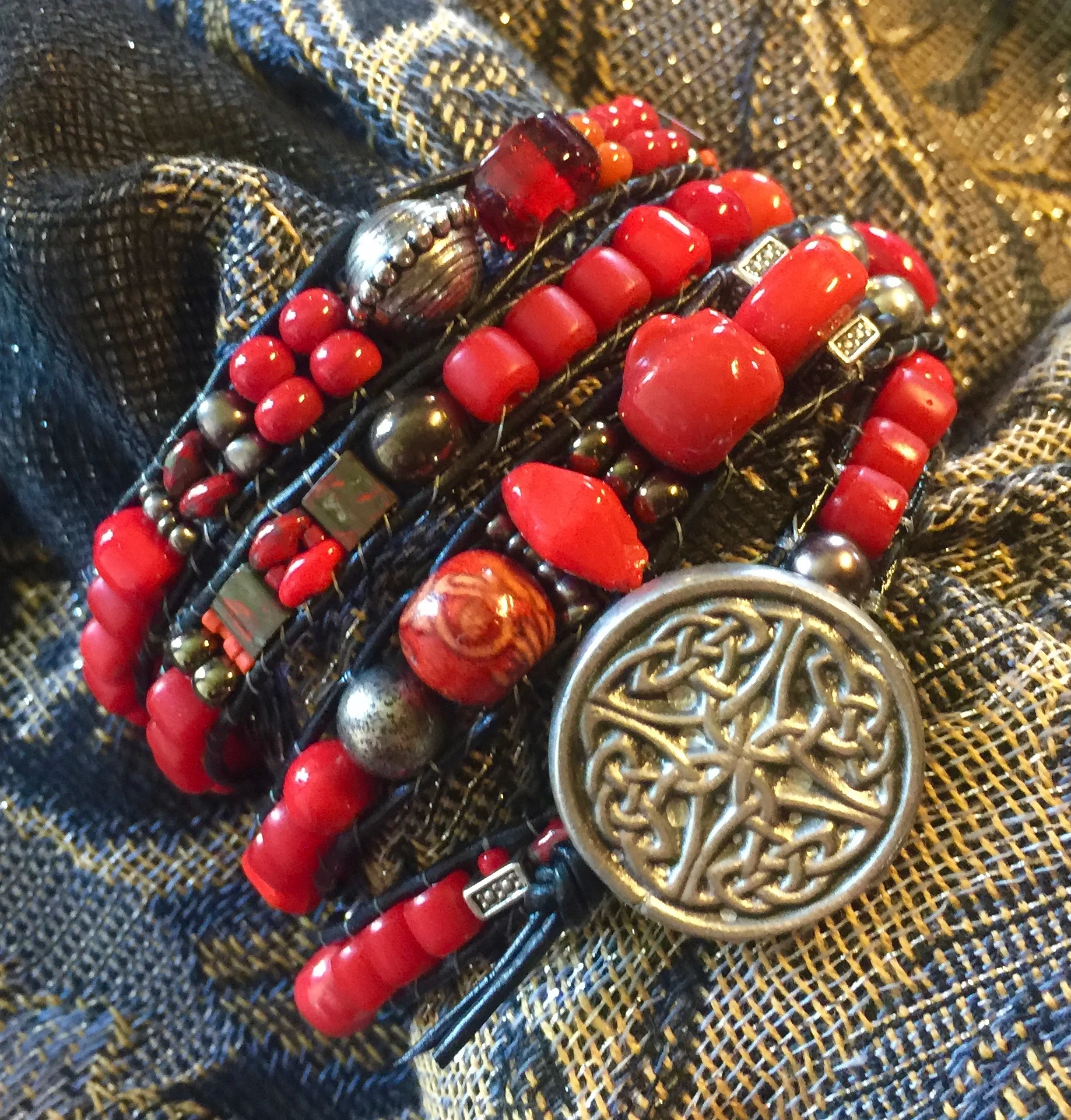 "Seeing Red" series, a four wrap bracelet with a hand forged button purchased at Feast of the Hunter's Moon.