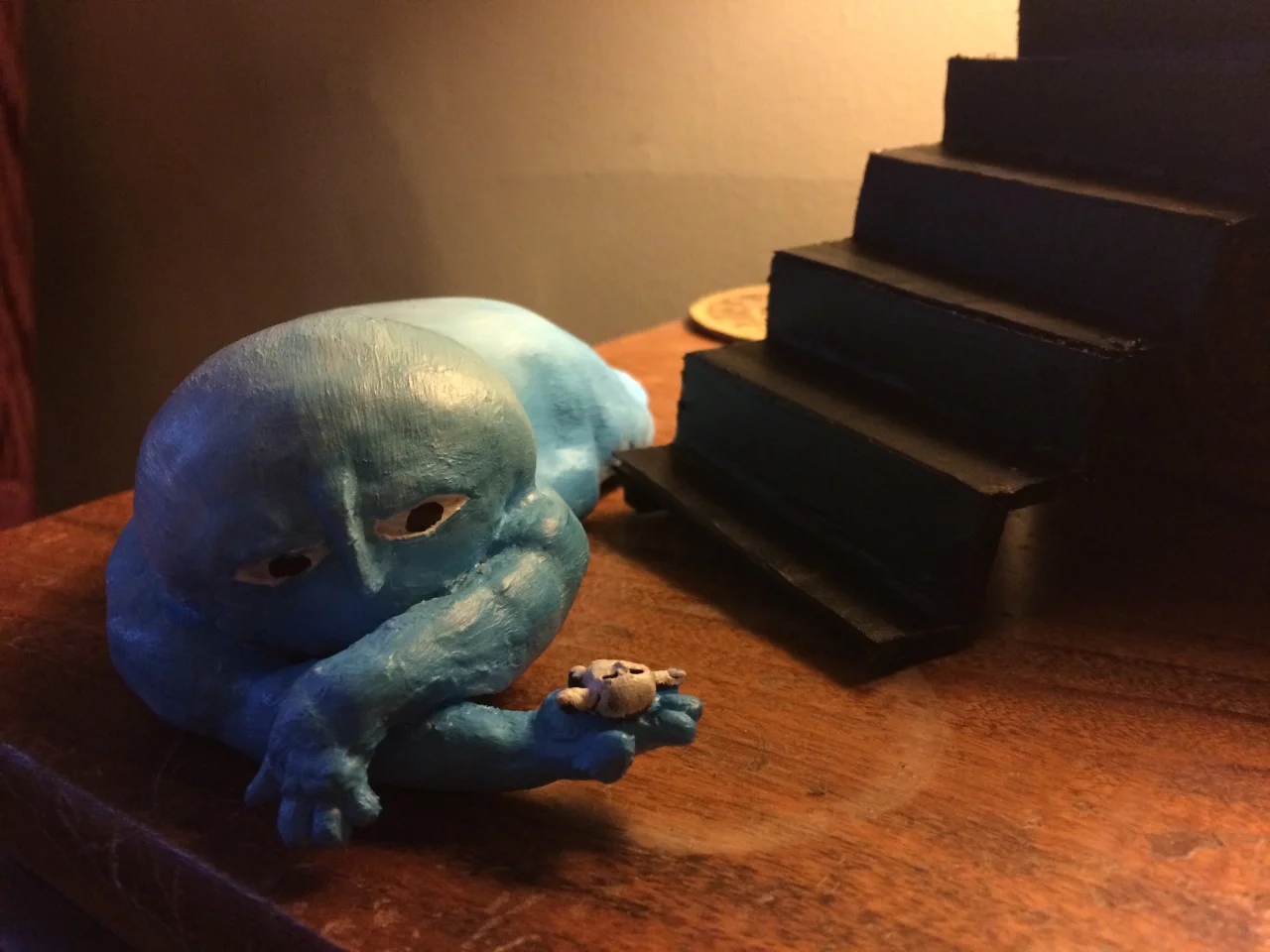 Milo is blue, well he is kinda sad, but blue?!?! I think he will change colors sometimes but mostly be white. He’s a little freaked out after falling down the stairs and finding himself in the palm of his hand.