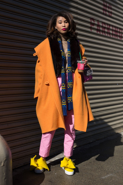8ivmc7-l-610x610-coat-nyfw+2017-fashion+week+2017-fashion+week-streetstyle-orange-orange+coat-oversized-oversized+coat-scarf-striped+scarf-pants-pink+pants-shoes-yellow-bow+shoes-slip+shoes.jpg