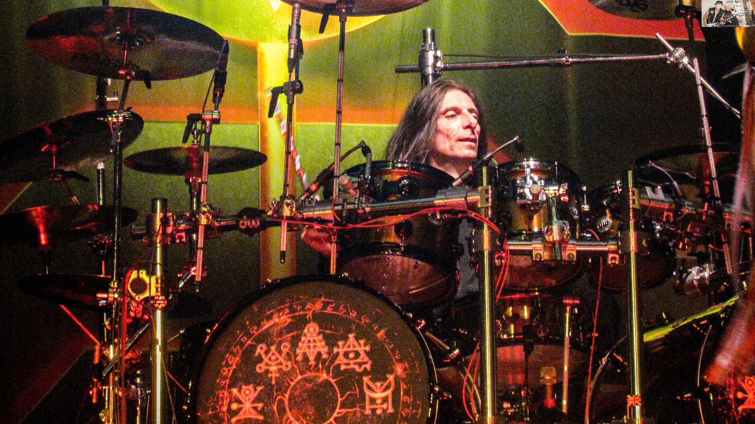 Scott Travis mans the drums on second song “Running Wild.”