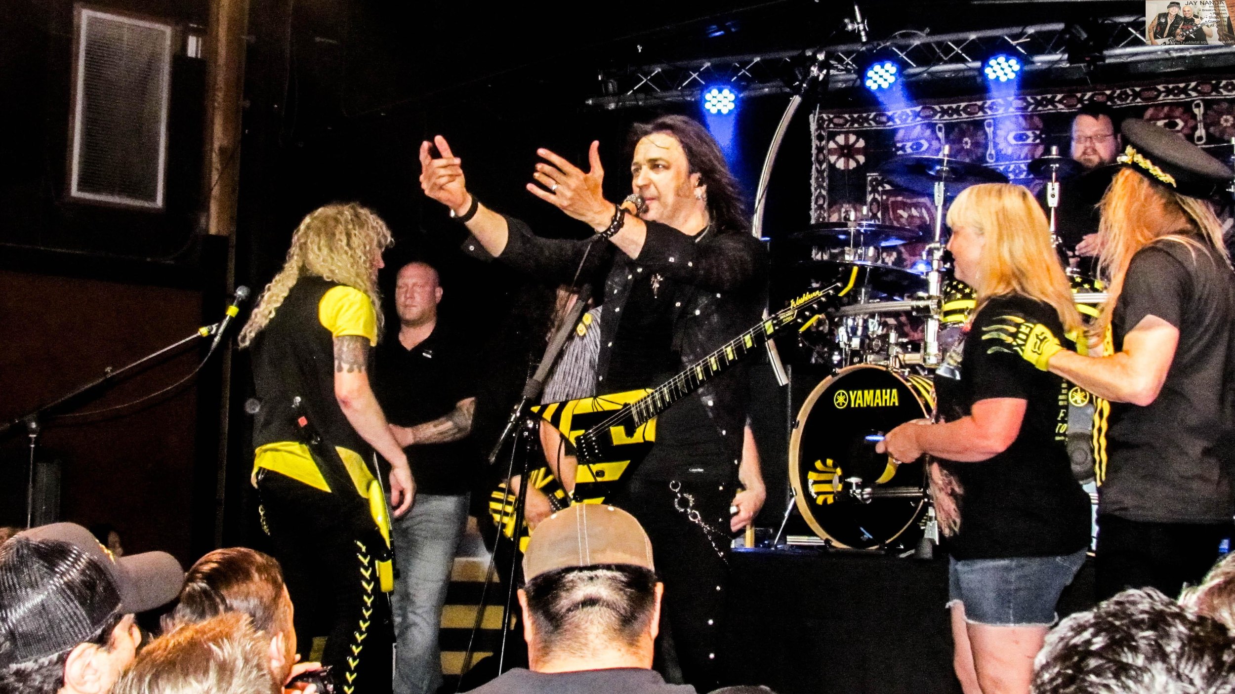  Stryper calls up a couple that paid to have their picture taken on stage with the band and the crowd while Michael Sweet encourages more approval. 