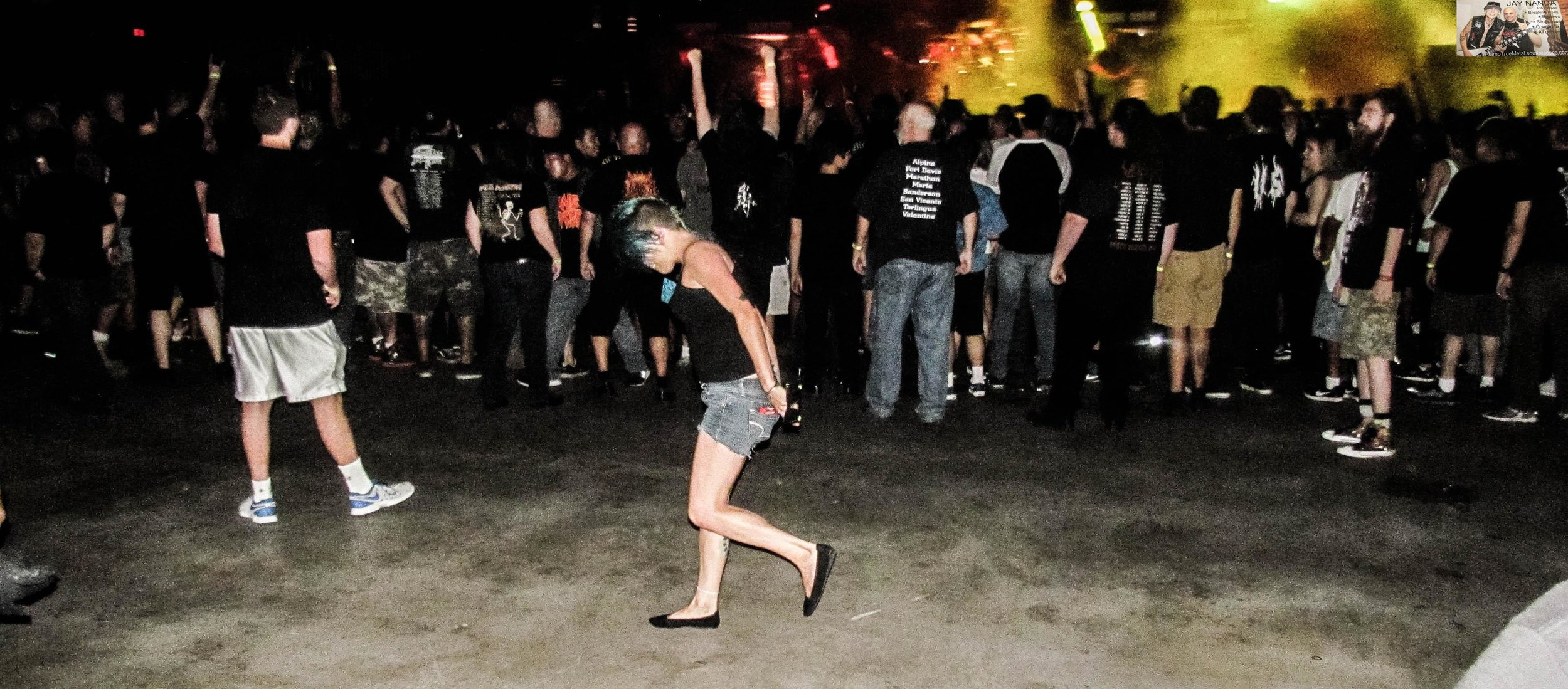  A young female mosher takes to the pits after the guys had cleared it out anticipating the end of Testament’s set. 